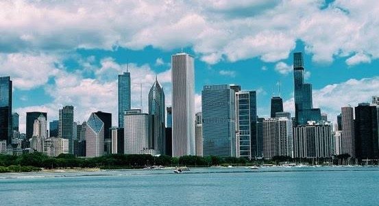 The Chicago skyline across the lake under summer clouds