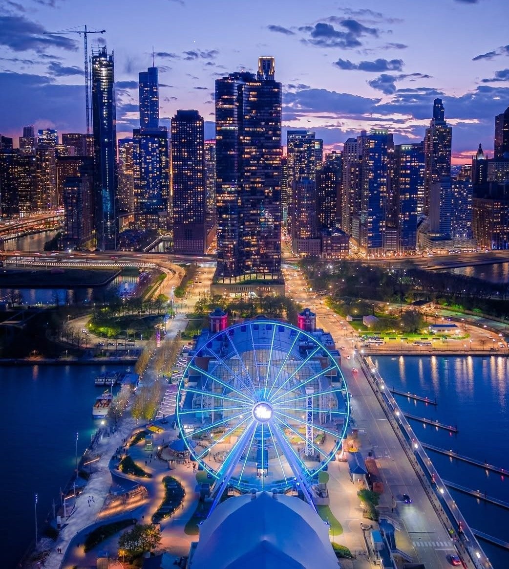 Navy Pier and its wheel lit at night, seen from above